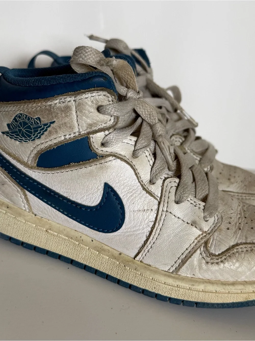 Air Jordan 1 Mid White and Navy Sneakers